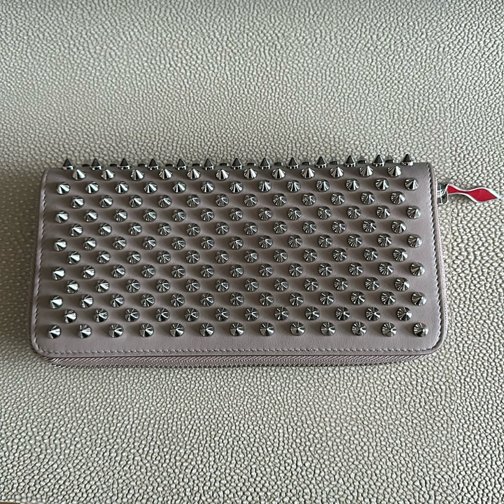 Spiked beige Louboutin wallet